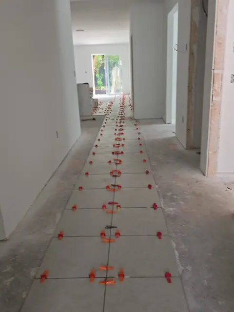 Floor tile installation along the hallway, real Bellagio Tile & Flooring work photo 36